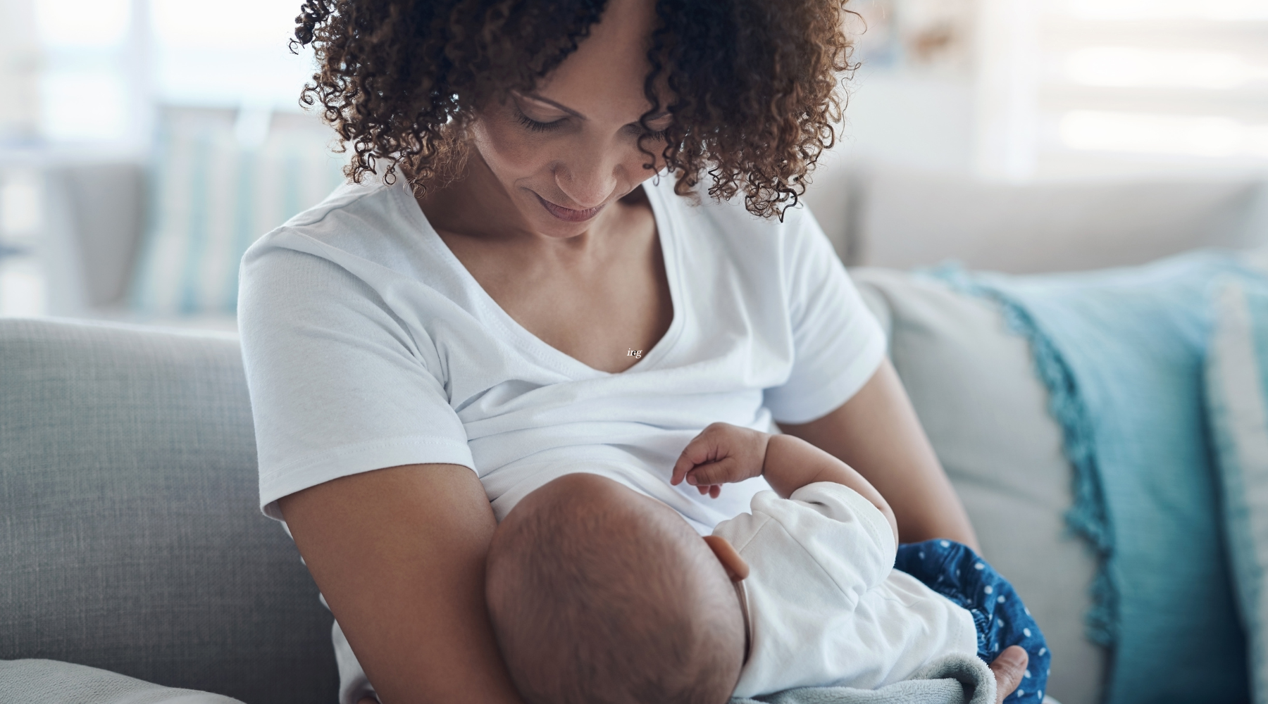 woman breastfeeding her baby | Oxford Healthspan